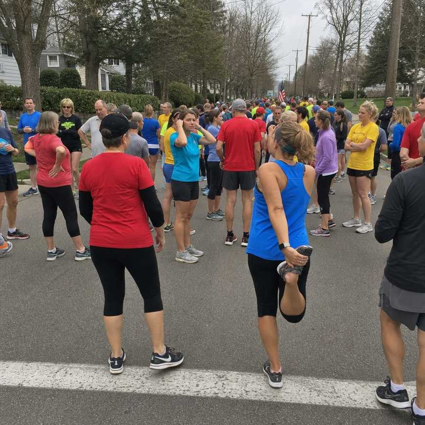 Relaxed start area of a small local 5K fun run with ordinary people of all ages