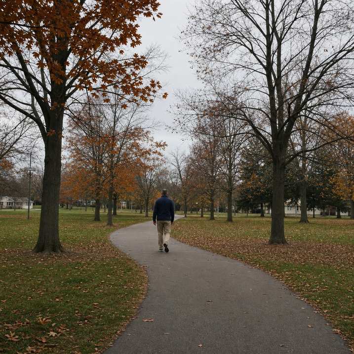 Person walking a loop on a local paved trail seen from a distance